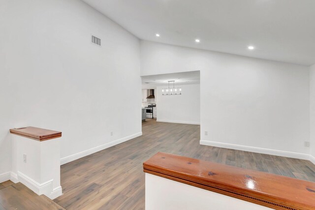 4770 Fox Hunt Trl, Boca Raton, FL 33487 - unfurnished living room featuring baseboards, wood finished floors, lofted ceiling, and recessed lighting