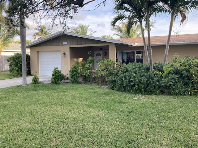 1672 Thumb Point Dr, Fort Pierce, FL 34949 - single story home featuring an attached garage, a front lawn, and stucco siding