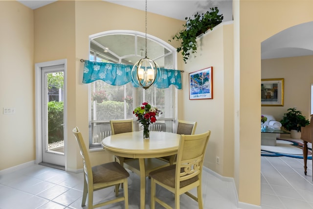 23437 Torre Cir, Boca Raton, FL 33433 - tiled dining area with a chandelier and arched walkways