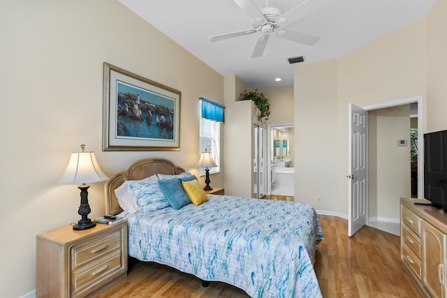 23437 Torre Cir, Boca Raton, FL 33433 - bedroom with light wood finished floors, connected bathroom, and ceiling fan