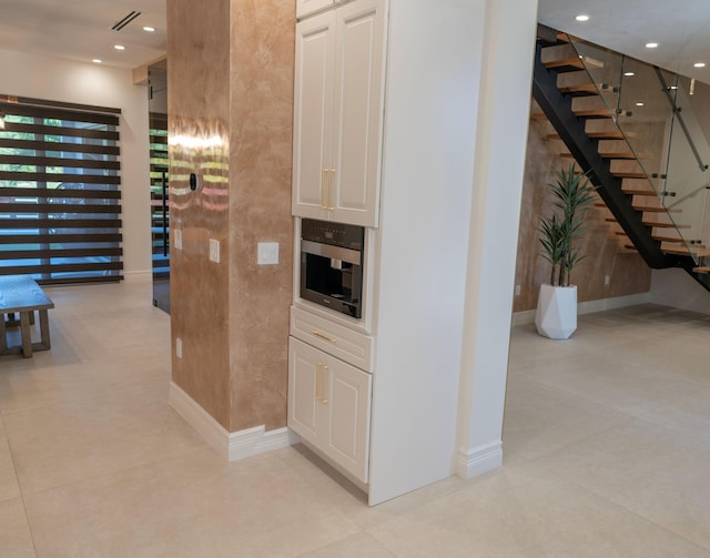 2810 F Rd, Loxahatchee Groves, FL 33470 - hallway with recessed lighting and stairway