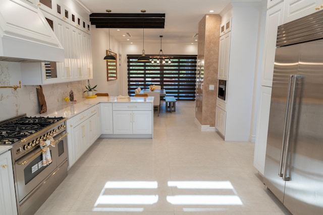2810 F Rd, Loxahatchee Groves, FL 33470 - kitchen featuring high end appliances, custom exhaust hood, white cabinetry, and recessed lighting