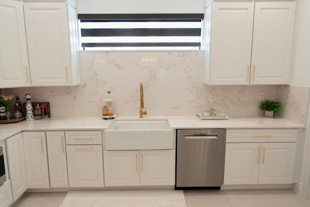 2810 F Rd, Loxahatchee Groves, FL 33470 - kitchen with stainless steel dishwasher, white cabinetry, and light tile patterned floors