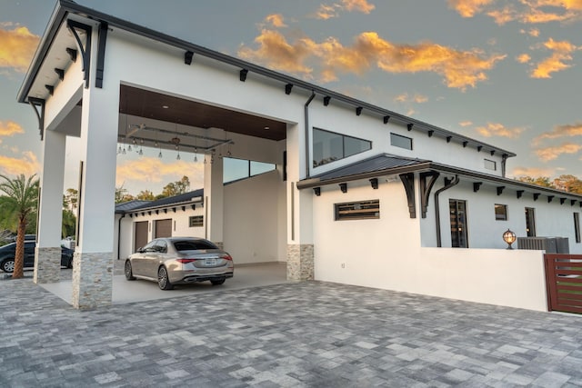 2810 F Rd, Loxahatchee Groves, FL 33470 - view of front of home with stucco siding, a standing seam roof, a metal roof, and stone siding