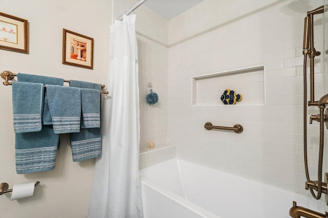bathroom with shower / bath combination with curtain