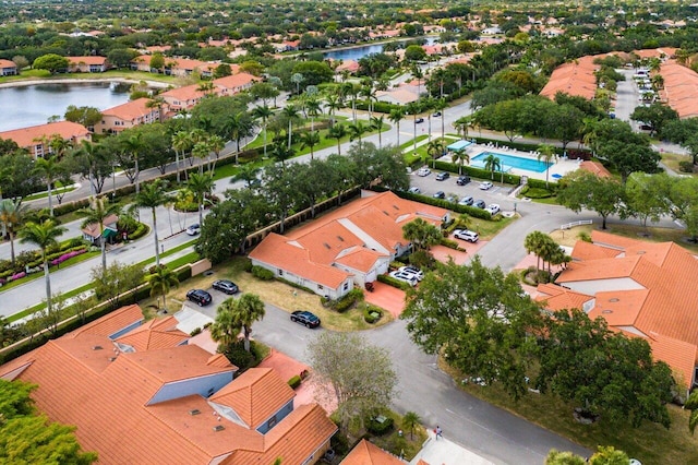 bird's eye view featuring a water view and a residential view