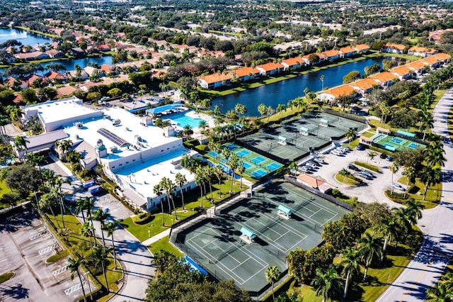 birds eye view of property with a water view
