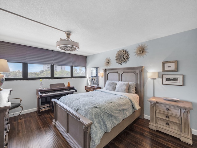 336 Golfview Rd Unit 406, North Palm Beach, FL 33408 - bedroom with dark wood-type flooring, baseboards, and a textured ceiling