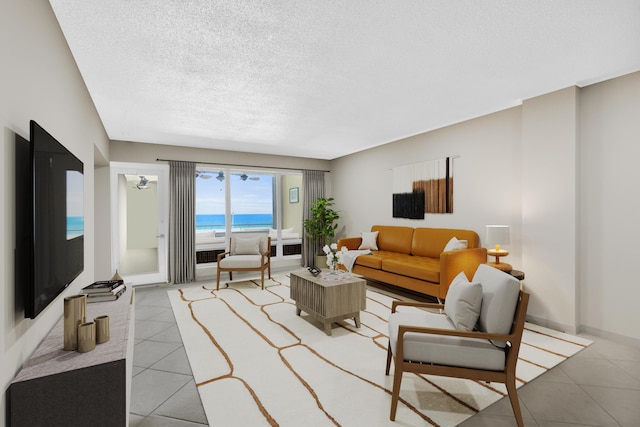 1850 S Ocean Blvd Unit 304, Lauderdale By The Sea, FL 33062 - living area featuring light tile patterned floors and a textured ceiling