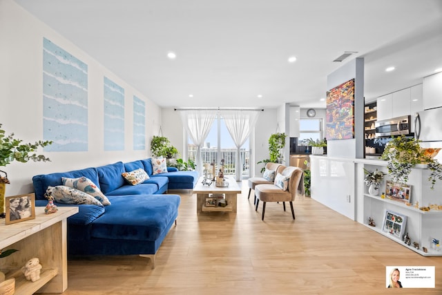 137 Golden Isles Dr Unit 1605, Hallandale Beach, FL 33009 - living area featuring light wood finished floors and recessed lighting