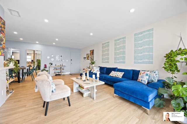 137 Golden Isles Dr Unit 1605, Hallandale Beach, FL 33009 - living room featuring light wood finished floors and recessed lighting