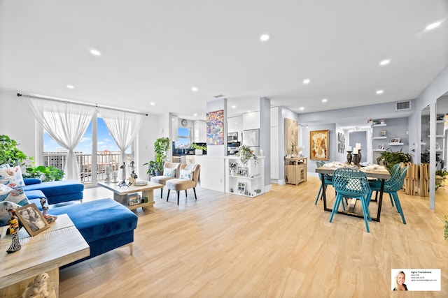 137 Golden Isles Dr Unit 1605, Hallandale Beach, FL 33009 - living area with light wood-type flooring and recessed lighting