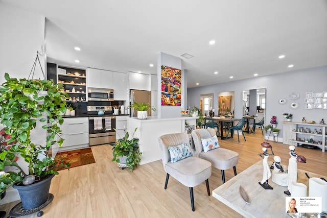 137 Golden Isles Dr Unit 1605, Hallandale Beach, FL 33009 - living area with light wood-type flooring and recessed lighting