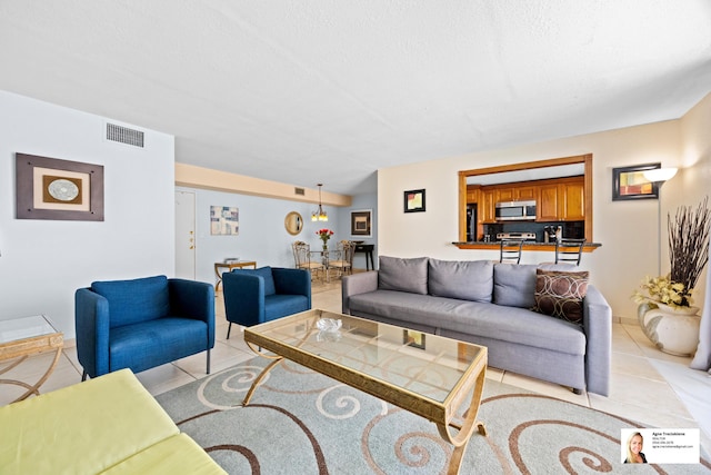 137 Golden Isles Dr Unit 501, Hallandale Beach, FL 33009 - living room with light tile patterned floors