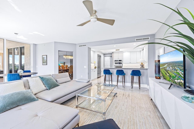 500 S US Highway 1 Unit 201, Jupiter, FL 33477 - living area with visible vents, baseboards, and ceiling fan