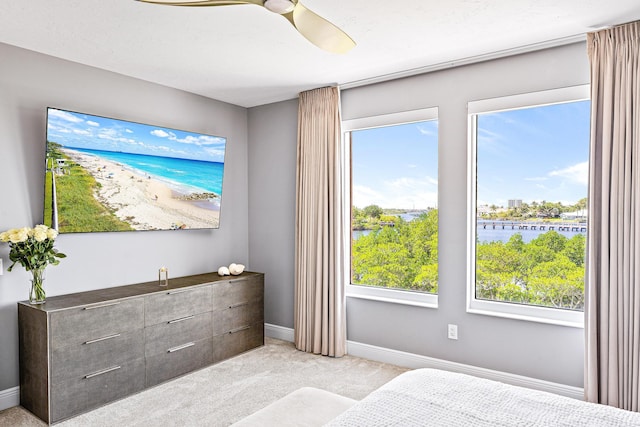 500 S US Highway 1 Unit 201, Jupiter, FL 33477 - unfurnished bedroom featuring light colored carpet, ceiling fan, baseboards, and a water view