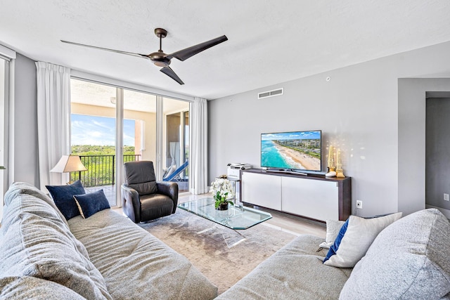 500 S US Highway 1 Unit 201, Jupiter, FL 33477 - living room featuring ceiling fan, wood finished floors, and visible vents