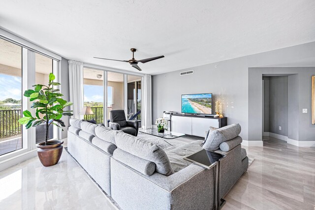 500 S US Highway 1 Unit 201, Jupiter, FL 33477 - living room featuring baseboards, visible vents, marble finish floor, and ceiling fan