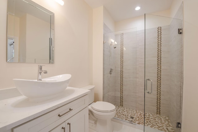 8280 Woodsmuir Dr, Palm Beach Gardens, FL 33412 - bathroom featuring a stall shower, toilet, vanity, and recessed lighting