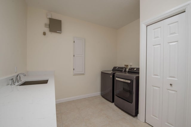 8280 Woodsmuir Dr, Palm Beach Gardens, FL 33412 - clothes washing area with washing machine and dryer, light tile patterned floors, and baseboards