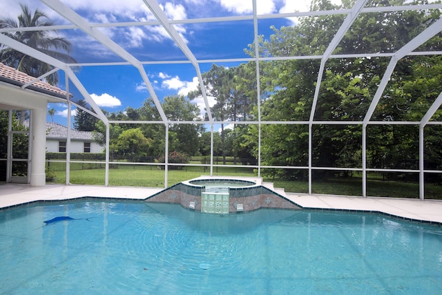 8280 Woodsmuir Dr, Palm Beach Gardens, FL 33412 - view of pool featuring a lanai, a patio area, a pool with connected hot tub, and view of wooded area