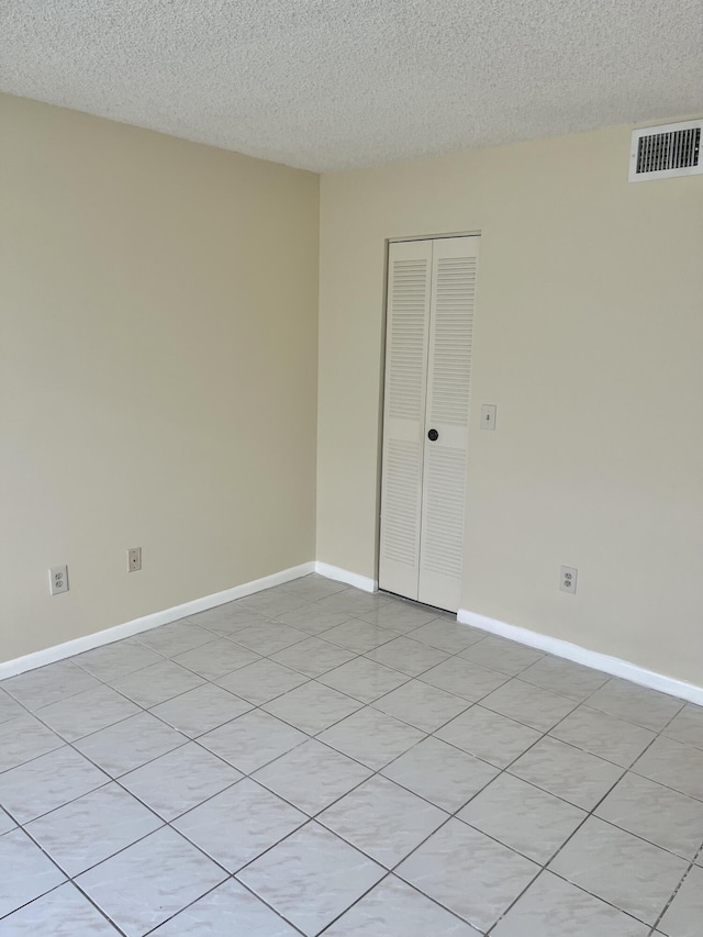3529 Englewood Dr Unit 313, Lake Worth, FL 33467 - unfurnished room with a textured ceiling and baseboards