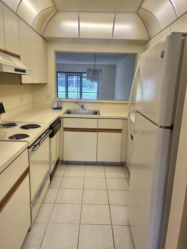 3529 Englewood Dr Unit 313, Lake Worth, FL 33467 - kitchen with white appliances, custom exhaust hood, a sink, and light countertops