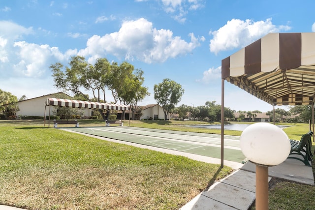 3529 Englewood Dr Unit 313, Lake Worth, FL 33467 - view of green lawn featuring a water view and shuffleboard