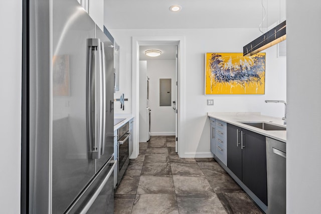 365 SE 6th Ave Unit 404, Delray Beach, FL 33483 - kitchen with recessed lighting, stainless steel appliances, light countertops, a sink, and baseboards