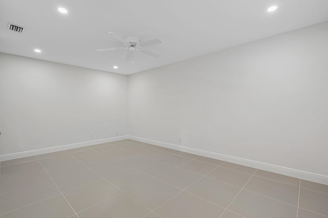 spare room featuring visible vents, a ceiling fan, recessed lighting, and baseboards