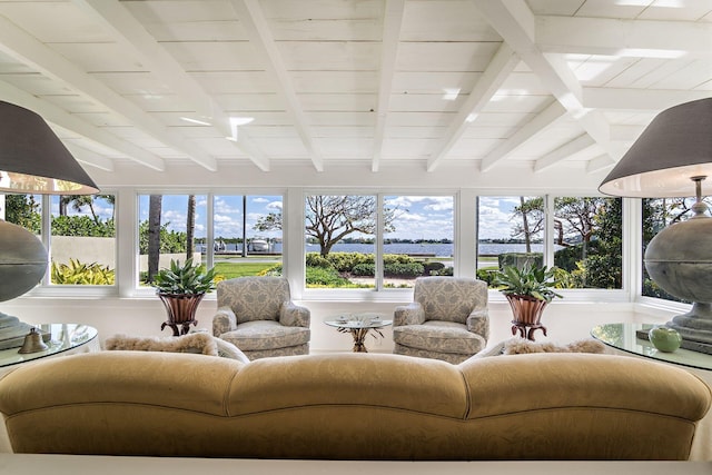 sunroom / solarium featuring beam ceiling