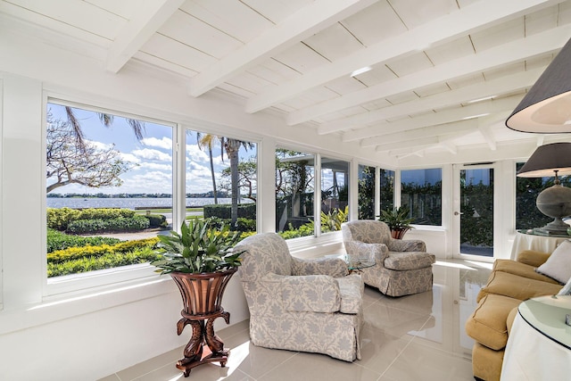 sunroom with tile patterned floors, beamed ceiling, and wooden ceiling