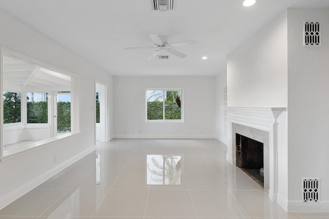 unfurnished living room with recessed lighting, visible vents, tile patterned floors, and baseboards