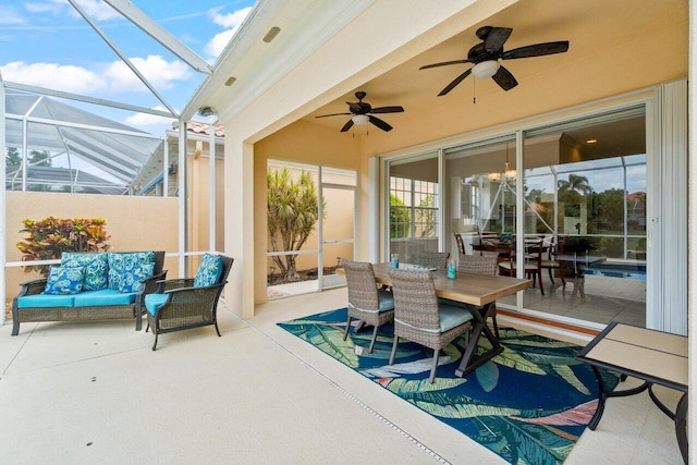 sunroom featuring outdoor dining area, ceiling fan, and outdoor lounge area