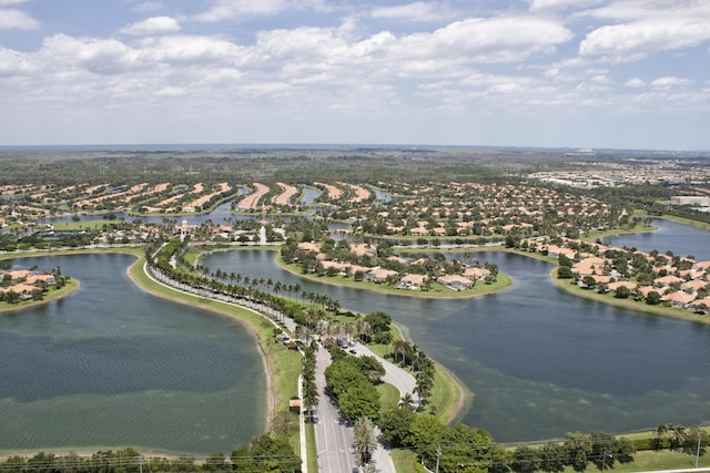 birds eye view of property featuring a water view and a residential view