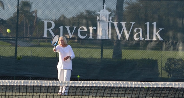 view of sport court with fence