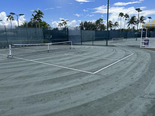 view of sport court featuring community basketball court and fence