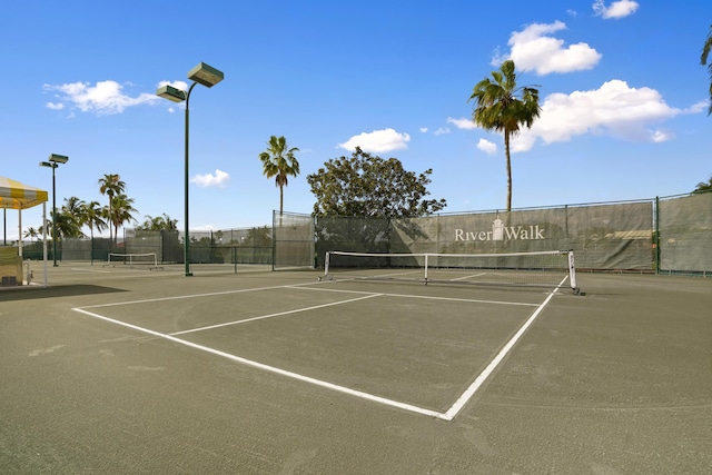 view of sport court featuring fence and community basketball court