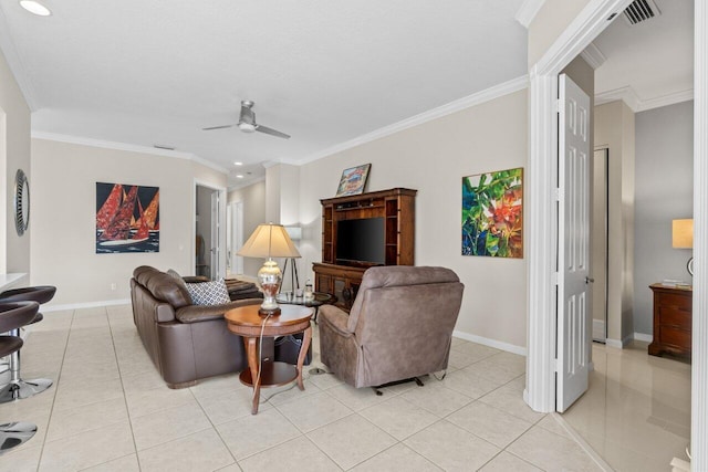 living room featuring light tile patterned floors, baseboards, ceiling fan, and crown molding