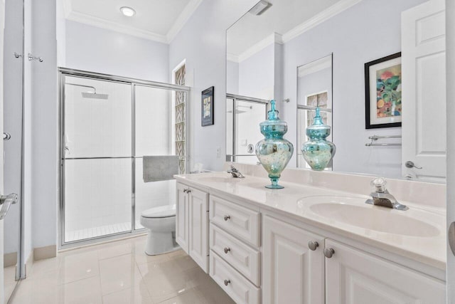 bathroom with a sink, a stall shower, toilet, and double vanity