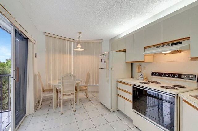 5910 Morningstar Cir Unit 401, Delray Beach, FL 33484 - kitchen with a textured ceiling, white appliances, pendant lighting, light countertops, and under cabinet range hood