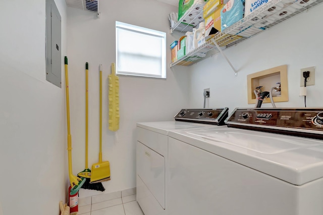 5910 Morningstar Cir Unit 401, Delray Beach, FL 33484 - clothes washing area featuring washing machine and dryer, electric panel, laundry area, and light tile patterned floors