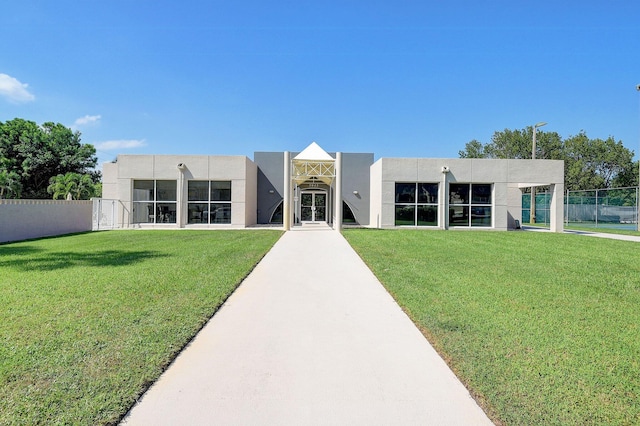 5910 Morningstar Cir Unit 401, Delray Beach, FL 33484 - back of house with a lawn, stucco siding, and fence