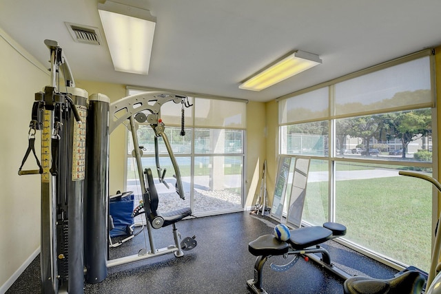 5910 Morningstar Cir Unit 401, Delray Beach, FL 33484 - workout area featuring a wall of windows, visible vents, and baseboards