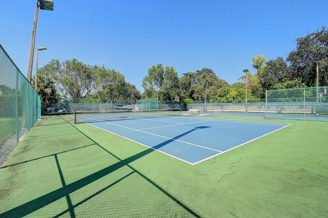 5910 Morningstar Cir Unit 401, Delray Beach, FL 33484 - view of tennis court featuring community basketball court and fence