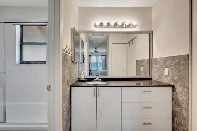 297 Cactus Hill Ct, Royal Palm Beach, FL 33411 - bathroom with tile walls, vanity, a stall shower, toilet, and ornamental molding