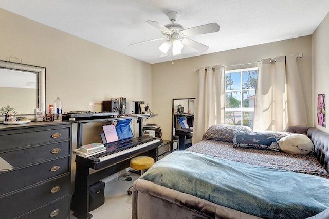 bedroom with ceiling fan and light tile patterned floors