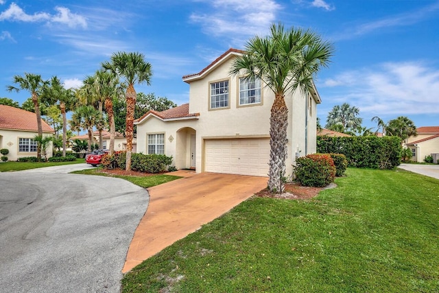 mediterranean / spanish-style house featuring a front lawn, stucco siding, an attached garage, a tile roof, and driveway