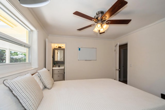 bedroom with a ceiling fan, ornamental molding, and ensuite bathroom