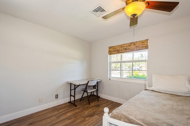 bedroom featuring dark wood finished floors, visible vents, a ceiling fan, and baseboards